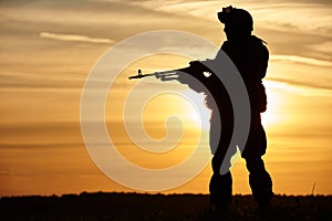 Military soldier silhouette with machine gun