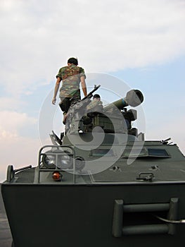 Military - soldiers on tank with machine gun