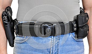 Military tactical belt with semi-automatic buckle for connection with cartridge pouch, placed on man`s belt, isolated - front view