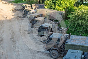 Military transportation troop trucks parked in a row