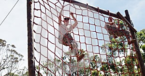Military troops climbing a net during obstacle course 4k