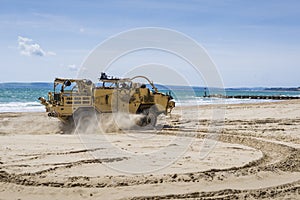 Military truck on the beach