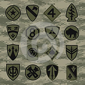 Military unit patch insignia set on green camouflage