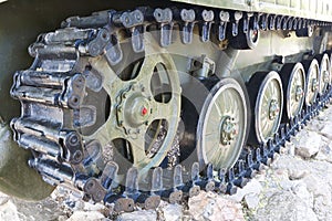 Military vehicles running gear on tracks