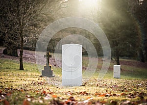 Military white British World War One grave with no inscription unknown soldier alone with sun rays shining peaceful and tranquil