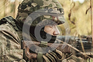 Military woman with a rifle