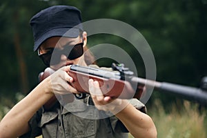 Military woman With weapons in hand, hunting target sunglasses weapons