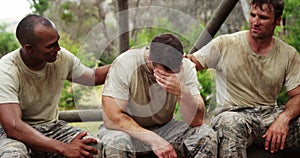 Militray soldiers consoling their teammate at boot camp 4k