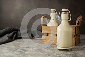 Milk bottle glass ion dark background, retro vintage styled glass milk bottle, diary product