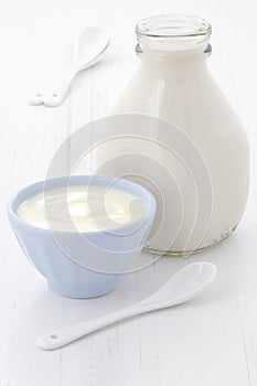 Milk bottle and plain yogurt