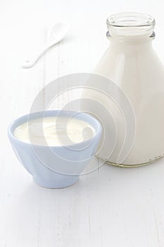 Milk bottle and plain yogurt