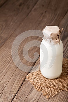 Milk bottle on wood table