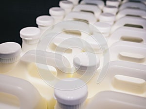 Milk bottles in row Fresh milk dairy product in supermarket fridge