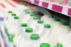 Milk bottles tidied in shelf