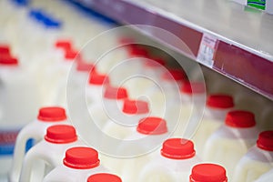 Milk bottles tidied in shelf