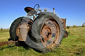 Milk can left on an old tractor