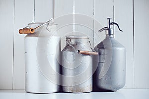 Milk cans and a siphon