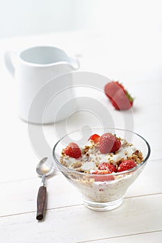 Milk with cereal and strawberries