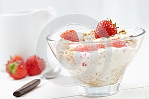 Milk with cereal and strawberries