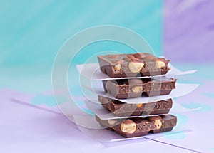 Milk chocolate bars on a pastel background