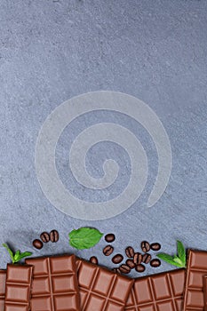 Milk chocolate chocolates bar food slate portrait format copyspace top view