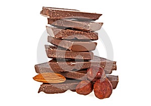 Milk chocolate with hazelnuts and almonds on white background