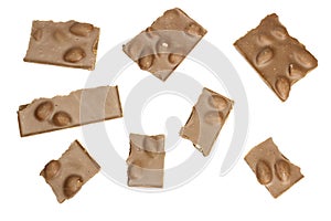 Milk chocolate with nuts broken into pieces isolated on white