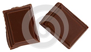 Milk chocolate pieces isolated on white background from top view