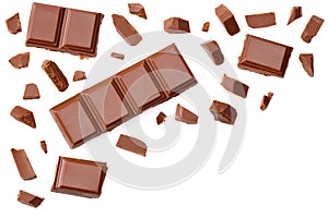 Milk chocolate pieces isolated on white background. top view