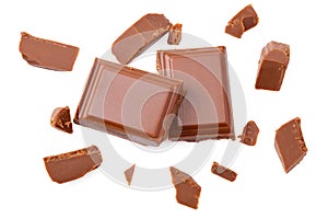 Milk chocolate pieces isolated on white background. top view