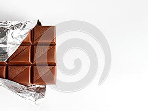 Milk chocolate on unfolded foil