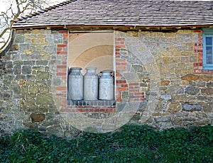 Old Milk Churns ready for collection photo