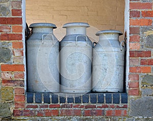 Old Milk Churns ready for collection photo