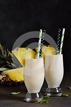 Milk cocktail with vanilla ice cream, pineapple and mango