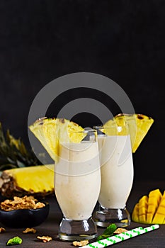 Milk cocktail with vanilla ice cream, pineapple and mango