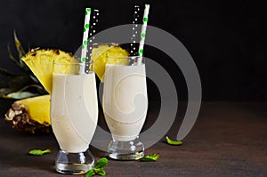 Milk cocktail with vanilla ice cream, pineapple and mango