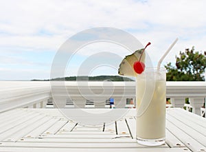 Milk coconut cocktail on table at beach cafe