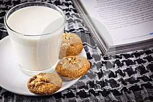 Milk, cookie and book