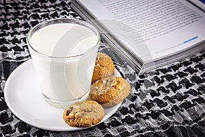 Milk, cookie and book