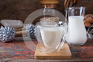 Milk cup on wooden on wooden background