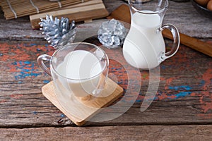 Milk cup on wooden on wooden background