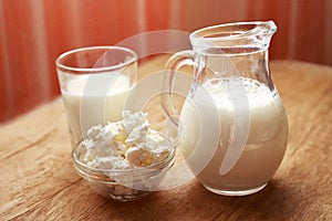 Milk and dairy products on wooden table