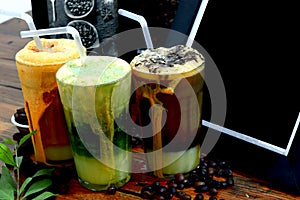 Milk drinks and cool tea flavors set in the background frame and coffee and green tea leaves