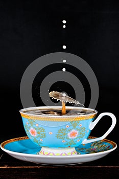 Milk Dropped Into Coffee To Create Water Drop Art