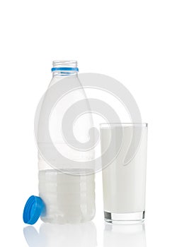 Milk glass and plastic bottle isolated on white background