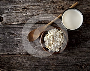 Milk in glass on a wooden background. Cottage cheese in a wooden