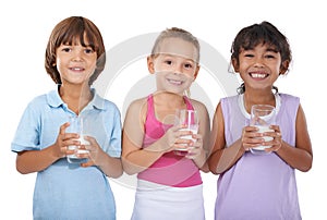 Milk, glasses and happy portrait of children with nutrition, health and wellness in white background of studio. Calcium