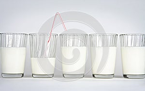 Milk glasses on a white background