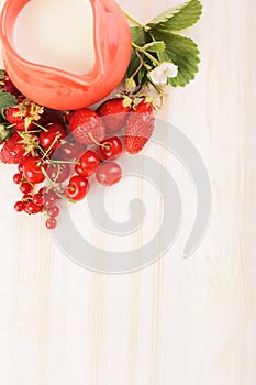 Milk jug and berries