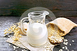 Milk oatmeal in jug on napkin